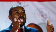 Zimbabwe main opposition leader Nelson Chamisa of the Movement for Democratic Change (MDC) Alliance gestures during a press conference on Zimbabwe's economic crisis on October 23, 2018 at his party headquarters in Harare. / AFP / Jekesai NJIKIZANA