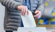 A voter casts his ballot for the state elections in Hesse (Hessen) at the polling station in Offenbach, central Germany, on October 28, 2018. Germany OUT / AFP / dpa / Uwe Anspach 