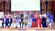 The participants of the workshop pose for a group photo with officials. 