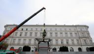 A statue of the late President Lech Kaczynski,which will be officially unveiled on Saturday as a part of the celebrations marking 100 years of Polish independence, is being set by workers at Pilsudski Square in Warsaw, Poland November 7, 2018. Agencja Gaz