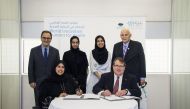Officials of WISH and The Carter Center signing the agreement in the presence of the Deans from Georgetown University in Qatar and Northwestern University in Qatar, as well as the participating students.