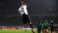 Juventus' Portuguese forward Cristiano Ronaldo celebrates after scoring during the Italian Serie A football match AC Milan vs Juventus on November 11, 2018 at the San Siro stadium in Milan. / AFP / Marco BERTORELLO
