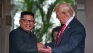 US President Donald Trump meets North Korean leader Kim Jong Un at the Capella Hotel on Sentosa island in Singapore, June 12, 2018. (Kevin Lim/The Straits Times via Reuters) 