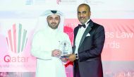 QFC’S Nasser Al Taweel (left), Chief Legal Officer and Board Secretary receiving the ‘General Counsel of the Year’ Award at the Qatar Business Law Forum & Awards.
