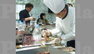 Chef Sham preparing chocolate. 