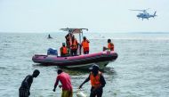Rescuers search for victims at the site of a capsized cruise boat on Lake Victoria near Mutima village, south of Kampala, Uganda, on November 25, 2018. Thirty people drowned and more than 60 were feared dead after a pleasure boat sank in Lake Victoria, Ug