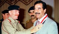Former Iraqi President Saddam Hussein is seen with aide Ezzat al-Douri in this undated Reuters file photo
