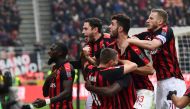 AC Milan's players celebrate after scoring a penalty during the Italian Serie A football match AC Milan vs Parma on Decembre 2, 2018 at the San Siro stadium in Milan. / AFP / Miguel MEDINA