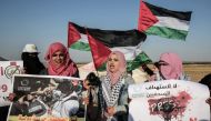 Palestinian Journalists take part in a protest against the killing of fellow journalist Yasser Murtaja near the Israel-Gaza border in Rafah in the southern Gaza Strip on April 8, 2018. AFP/Said Khatib