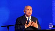 Israeli Prime Minister Benjamin Netanyahu speaks during an Likud Party gathering marking the first day of the eight-day Jewish holiday of Hanukkah, in Ramat Gan, Israel December 2, 2018. REUTERS/Corinna Kern