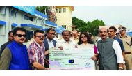 Representatives of ICBF handing over the cheque to Chief Minister of Karnataka, H D Kumaraswami.