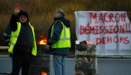 Protesters wearing yellow vests occupy a traffic island near the A2 Paris-Brussels motorway as part of the 