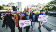 Palestinians gather to protest the US-sponsored draft resolution condemning Palestinian resistance group Hamas in General Assembly of the United Nations meeting in Gaza City, December 06, 2018. (Mustafa Hassona - Anadolu Agency)