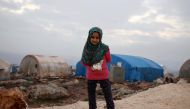 Syrian Maya Merhi poses for a picture in the Internally Displaced Persons (IDP) camp of Serjilla in northwestern Syria next to Bab al-Hawa border crossing with Turkey, on December 9, 2018.  / AFP / Aaref WATAD 