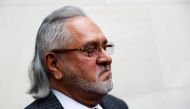 Vijay Mallya has a break outside the court house as he waits for his extradition case to be heard at Westminster Magistrates Court, in London, Britain, December 10, 2018. REUTERS/Peter Nicholls