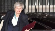 Britain's Prime Minister Theresa May returns to Downing street after postponing a parliamentary vote on her Brexit deal in London on December 10, 2018. / AFP / Ben STANSALL