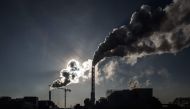 Smoke rises from the chimneys of a waste incineration plant in Saint-Ouen on the outskirts of the French capital Paris, on December 12, 2018. / AFP / Philippe LOPEZ