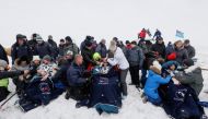 The International Space Station (ISS) crew members Serena Aunon-Chancellor of the U.S., Alexander Gerst of Germany and Sergey Prokopyev of Russia rest after the landing of the Soyuz MS-09 capsule in a remote area near the town of Zhezkazgan, formerly know