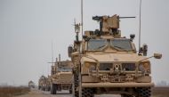 A Coalition convoy of U.S. led international coalition against the Islamic State of Iraq and the Levant (ISIL) stops to test fire their M2 machine guns and MK19 grenade launcher in the Middle Euphrates River Valley in the Deir ez-Zor province, Syria, Nove