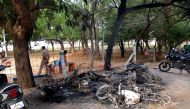 FILE PHOTO: Charred vehicles are pictured near a government office, after at least 13 people were killed when police fired on protesters seeking closure of plant on environmental grounds in town of Thoothukudi in southern state of Tamil Nadu on Tuesday, M