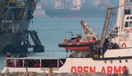 The ship of Spanish NGO Proactiva Open Arms arrives in the southern Spanish port of Algeciras in Campamento near San Roque, with 311 migrants on board,on December 28, 2018. AFP / JORGE GUERRERO