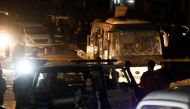 Police officers inspect a scene of a bus blast in Giza, Egypt, December 28, 2018. (REUTERS/Amr Abdallah Dalsh)
