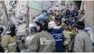 Emergency officers transporting a surviver after a gas explosion rocked a residential building in Russia's Urals city of Magnitogorsk.  AFP 