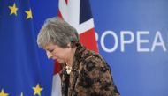 (FILES) In this file photo taken on December 14, 2018 Britain's Prime Minister Theresa May leaves after speaking during a press conference on December 14, 2018 in Brussels during the second day of a European Summit aimed at discussing the Brexit deal, the