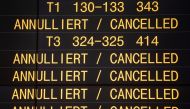 A board displays cancelled flights during a one-day strike by security staff at Stuttgart's airport on January 10, 2019.  AFP / dpa / Marijan Murat
 
