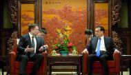 Tesla CEO Elon Musk speaks as Chinese Premier Li Keqiang listens during a meeting at the Zhongnanhai leadership compound in Beijing, China, January 9, 2019. Mark Schiefelbein/Pool via Reuters