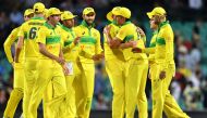 Australia's players celebrate their victory over India in the first one-day international (ODI) match at the Sydney Cricket Ground in Sydney on January 12, 2019. (AFP / Saeed Khan)