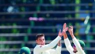 South African bowler Duanne Olivier (C) celebrates the dismissal of Pakistan batsman Sarfraz Ahmed (not in picture) during the fourth day of the third Cricket Test match between South Africa and Pakistan at Wanderers cricket stadium on January 14, 2019 in
