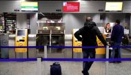 Stranded passenger get information at a check-in desk of German airline Lufthansa during a strike of security personnel over higher wages at Germany's largest airport in Frankfurt, Germany, January 15, 2019. REUTERS/Kai Pfaffenbach