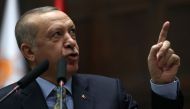 Turkish President and leader of Turkey's ruling Justice and Development (AK) Party Recep Tayyip Erdogan addresses his party's parliamentary group at the Grand National Assembly of Turkey in Ankara, on January 15, 2019. / AFP / Adem ALTAN