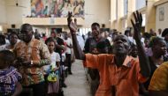 Catholic worshipers attend a Sunday mass at the Saint Joseph church on January 13, 2019, in the capital Kinshasa, in the Democratic Republic of the Congo. AFP / Tony Karumba 