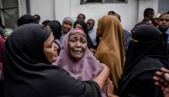Relatives of Abdalla Mohamed Dahir who was killed the previous day in an attack react as his body arrives to the mosque during his burial ceremony in Nairobi on January 16, 2018. AFP / Luis Tato 