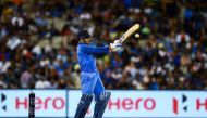 India's Mahendra Singh Dhoni plays a shot during the third one-day international cricket match between Australia and India at the Melbourne Cricket Ground in Melbourne on January 18, 2019. (AFP / Jewel SAMAD)