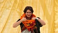 File photo of Priyanka Gandhi Vadra, daughter of India's ruling Congress party chief Sonia Gandhi, adjusts her flower garlands as she campaigns for her mother during an election meeting at Rae Bareli in the northern Indian state of Uttar Pradesh April 22,