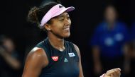 Japan's Naomi Osaka celebrates her victory against Czech Republic's Karolina Pliskova during their women's singles semi-final match on day 11 of the Australian Open tennis tournament in Melbourne on January 24, 2019. AFP / Greg Wood 