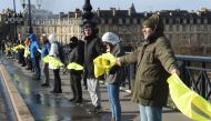 Protesters form a human chain on the Stone Bridge (Pont de pierre) in Bordeaux, western France, on January 27, 2019, during an anti-government demonstration called by the 