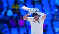Joe Denly of England is bowled by Alzarri Joseph of West Indies during day 3 of the 2nd Test between West Indies and England at Vivian Richards Cricket Stadium in North Sound, Antigua and Barbuda, on February 02, 2019. AFP / Randy Brooks