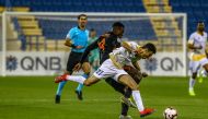 Umm Salal’s Luwrance Quaya and Al Gharafa’s Muath Yahya Al Salemi vie for the ball possession during yesterday’s QNB Stars League Round 16 clash.