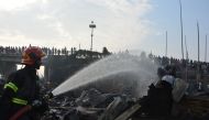A firefighter works to extinguish fire at a slum where at least eight people killed in Chittagong, Bangladesh February 17, 2019. REUTERS/Stringer 