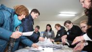 Members of a local electoral commission count votes following a parliamentary election in Chisinau, Moldova February 24, 2019. REUTERS/Vladislav Culiomza
