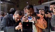 People take pictures of the new Mate X smartphone, ahead of the Mobile World Congress (MWC 19) in Barcelona, Spain, February 24, 2019. Reuters/Sergio Perez