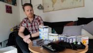 David Burns, 38, who has type 1 diabetes, poses for a prepares his insulin pen to inject himself in his home in North London on February 24, 2019. AFP / Niklas Halle'n 