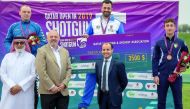 Italy’s Alessandro Chianese (top, right) celebrates on the podium with the silver medallist Hubert Andrzej Oleinik (Slovakia) and compatriot Andrea Vescovi and officials during the presentation ceremony, yesterday.