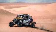 Qatari driver Adel Abdulla and French co-driver Jean-Michel Polato in action during the opening day of the Dubai International Baja yesterday.