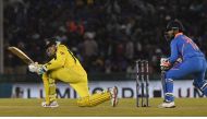 Australia cricketer Peter Handscomb (L) plays a shot as India wicket keeper Rishab Pant (R) looks on during the fourth one-day international (ODI) cricket match between India and Australia at the Punjab Cricket Association Stadium in Mohali on March 10, 2