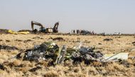 A power shovel digs next to debris at the crash site of Ethiopia Airlines near Bishoftu, a town some 60 kilometres southeast of Addis Ababa, Ethiopia, on March 11, 2019. AFP / Michael TEWELDE
